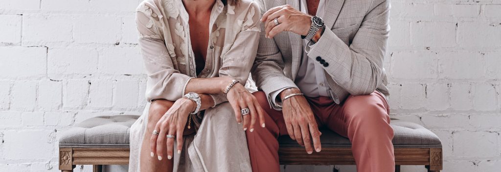 couple sitting with muted clothes.