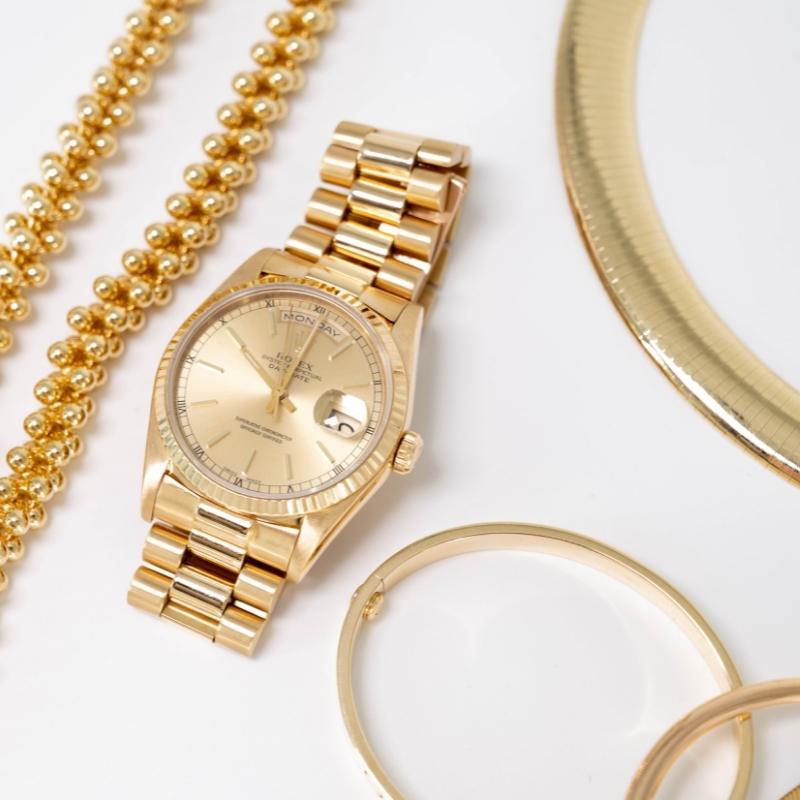 Gold Rolex watch, necklace, earings, etc.