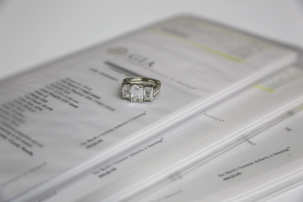 This ring's value significantly increases because it has a GIA certification for each of its three stones.