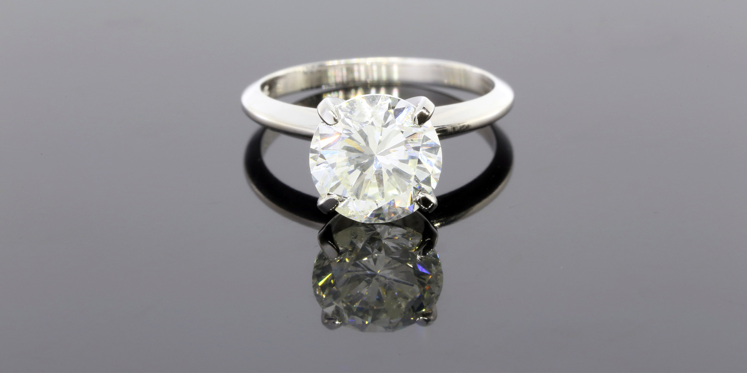 A customer borrowed $10,000 against this three carat average quality round cut diamond.