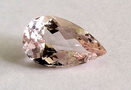 A light pink, pear-shaped morganite stone.