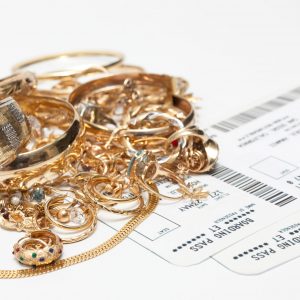 Pile-Of-Gold-Jewelry-On-Bording-Pass