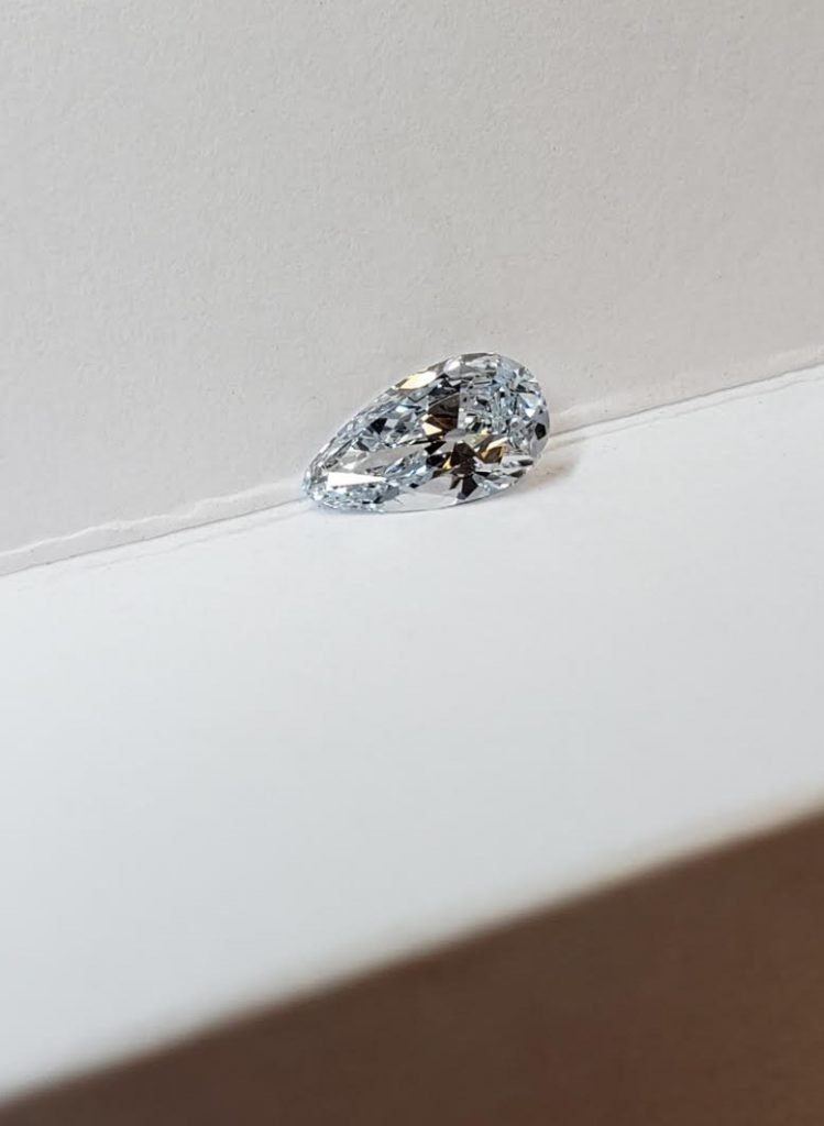 This fancy light blue diamond was cut into the shape of a pear to intensify the blue saturation.