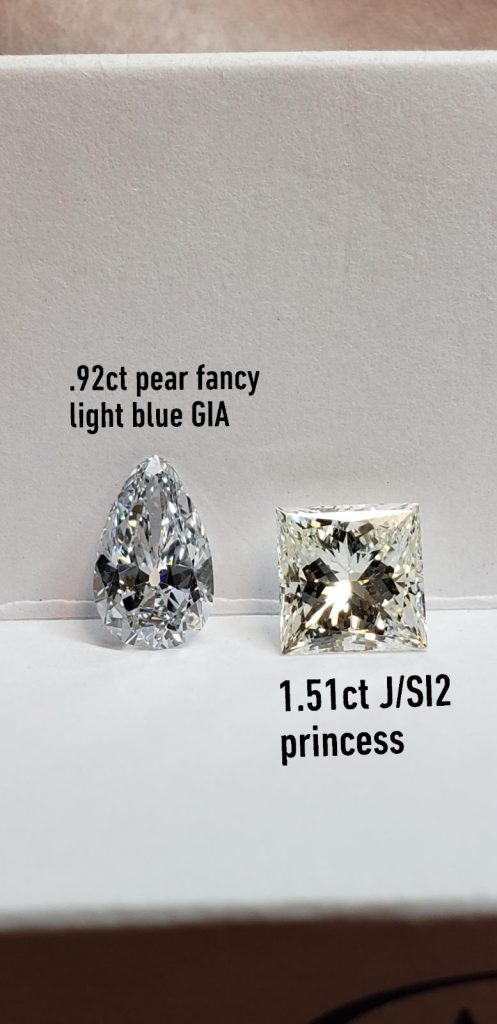 The “J” color diamond would typically appear white to the naked eye but next to this fancy light blue diamond, the near-colorless diamond appears very yellow.