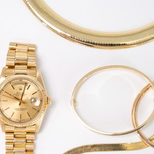 Gold Rolex watch, necklace, earrings, and other jewelry