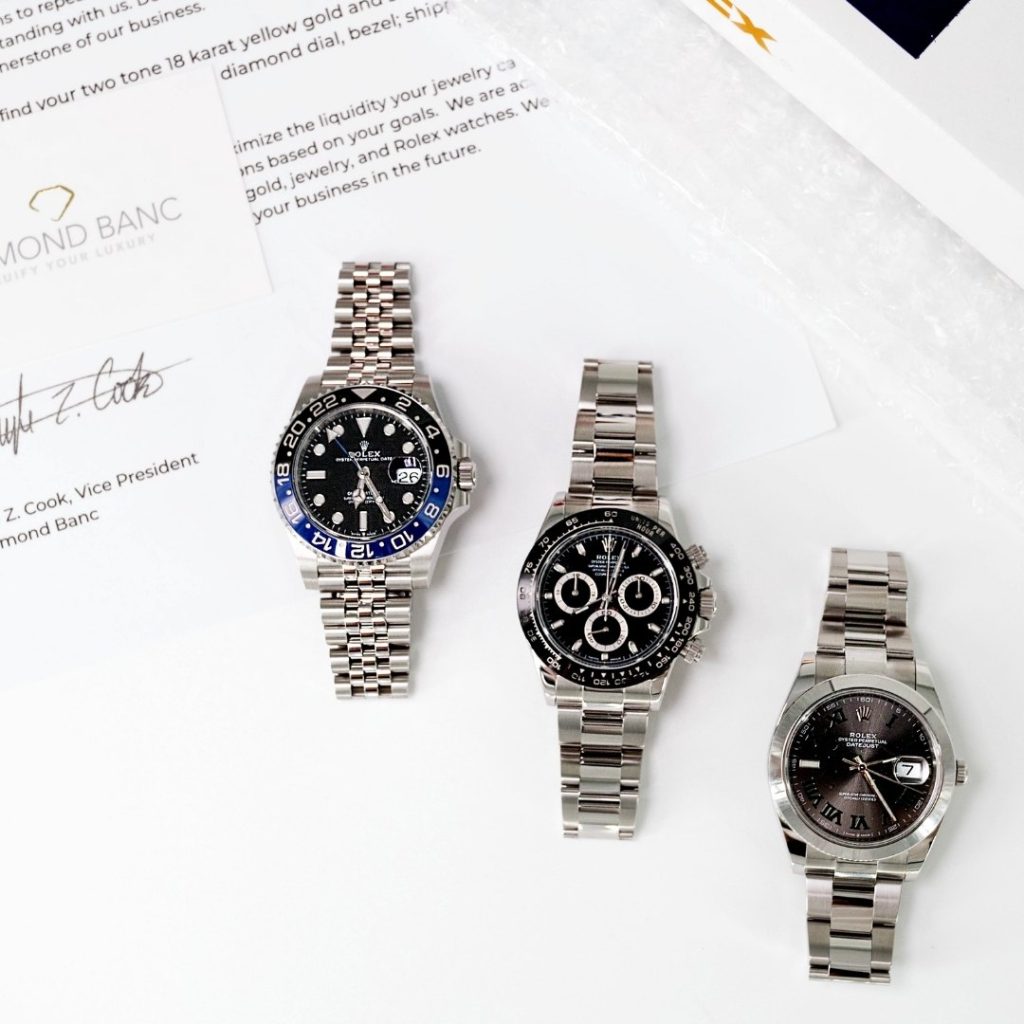 three Rolex watches with Diamond Banc papers