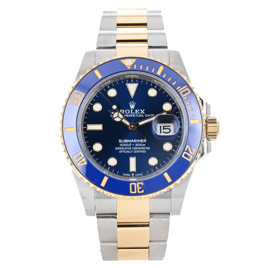 A Rolex Submariner watch with a blue dial and bezel, gold and silver two-tone bracelet, and date display at the 3 o'clock position.