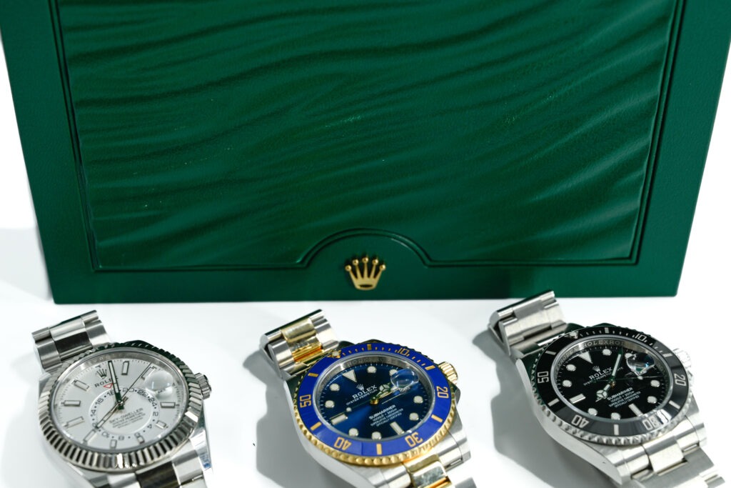 Rolex watch in front of Diamond Banc box