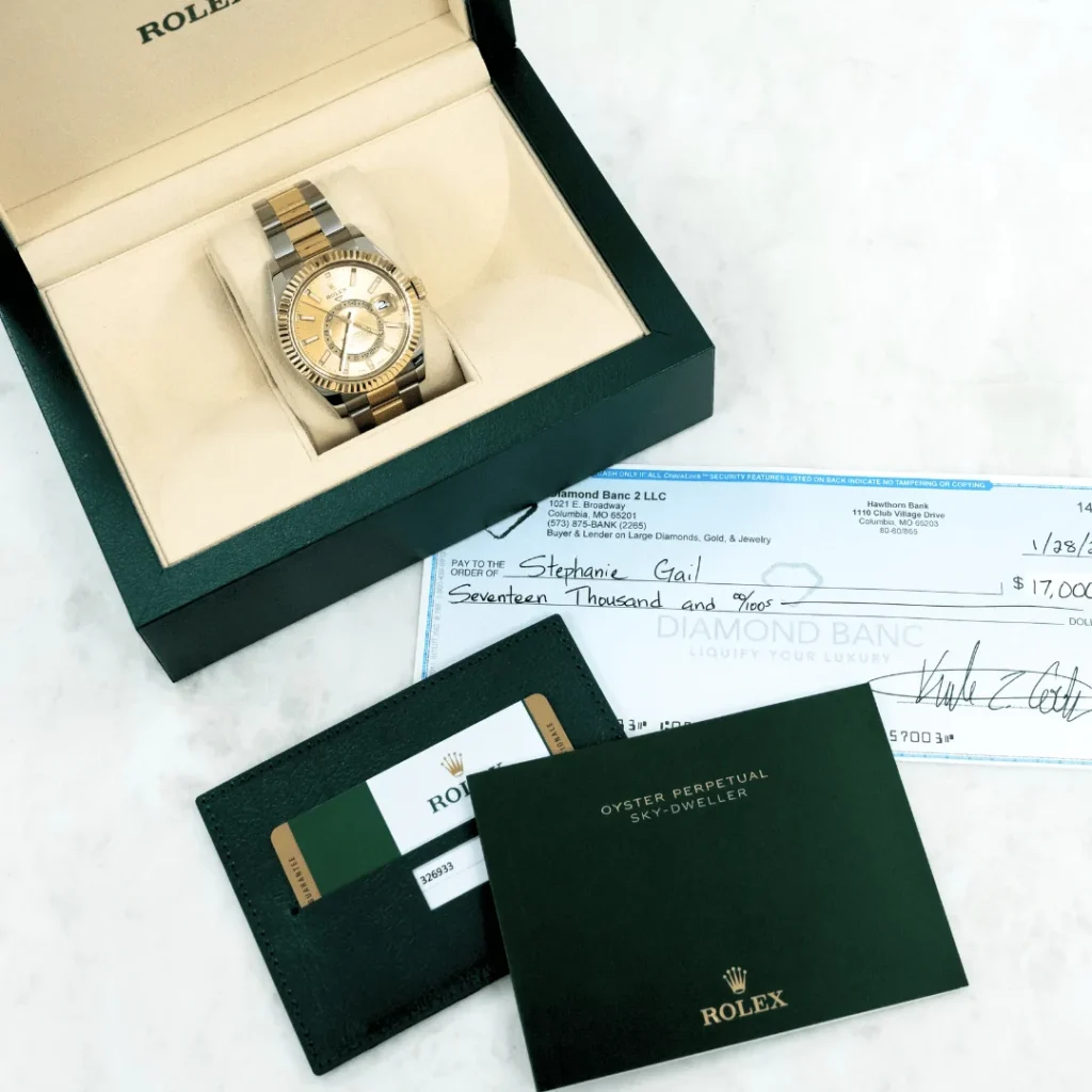 Rolex watch and a check from Diamond Banc