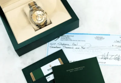 Rolex watch and a check from Diamond Banc