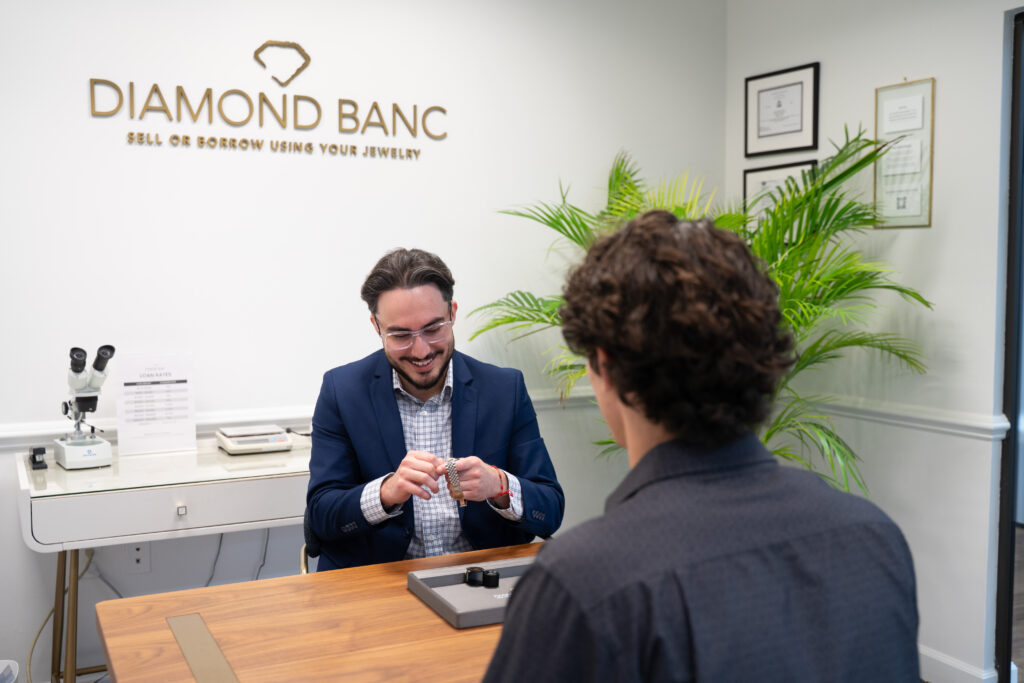 Diamond Banc employee checking Rolex watch
