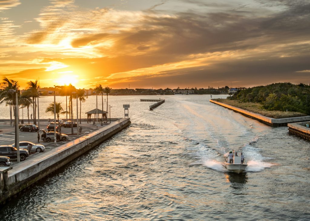 A boat on the water at sunset