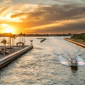 A boat on the water at sunset