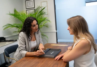 Diamond Banc Orlando director meeting with a client during a luxury watch evaluation